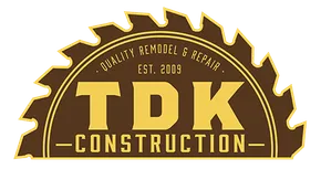TDK Construction logo: yellow text